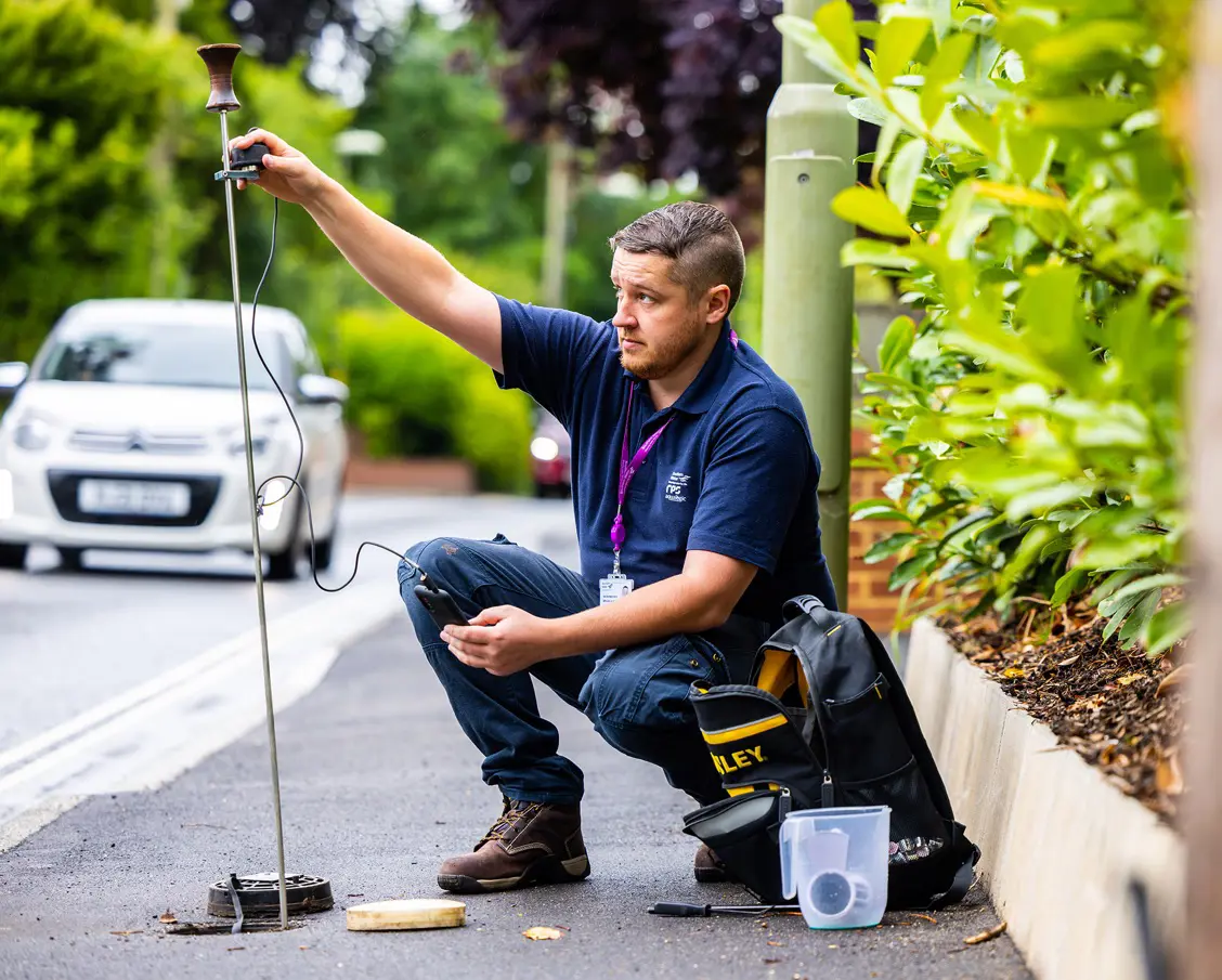 Worker preforming tests on water underground