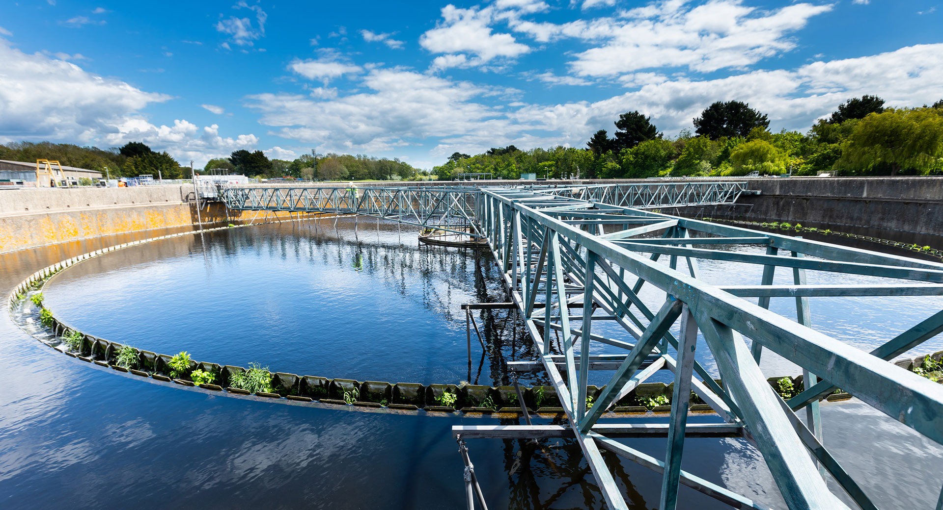 A circular clarifier at the Peel Common Wastewater Treatment Works on a sunny day