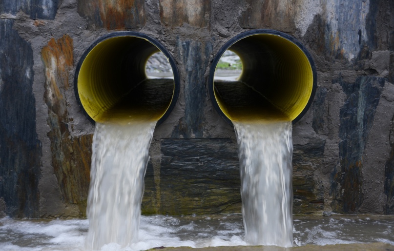 Water rushing from an outfall into the sea