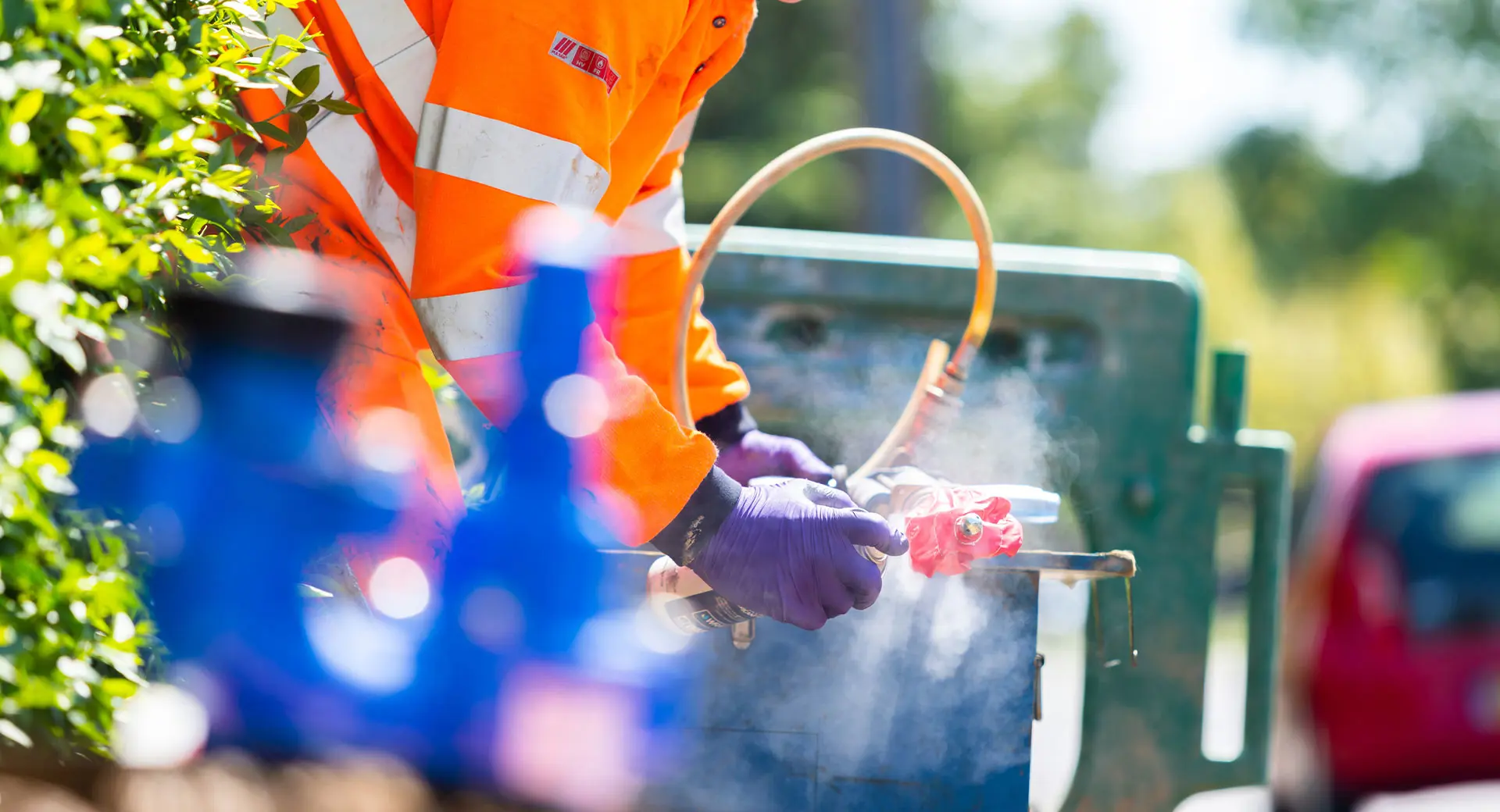 A Clancy Repair Team engineer carrying out repairs on a street on a bright day