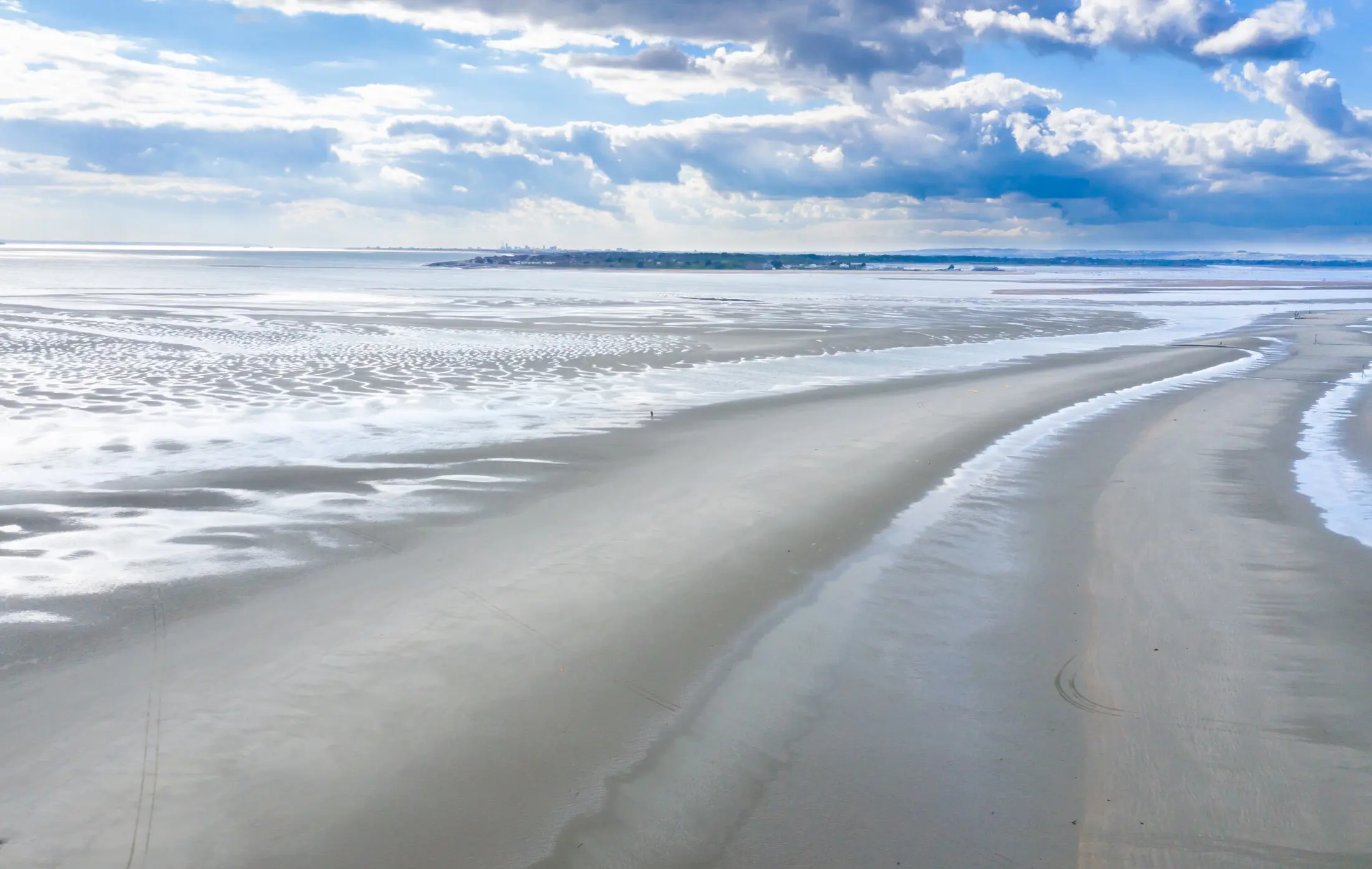 An aerial view of a person walking on West Wittering Beach