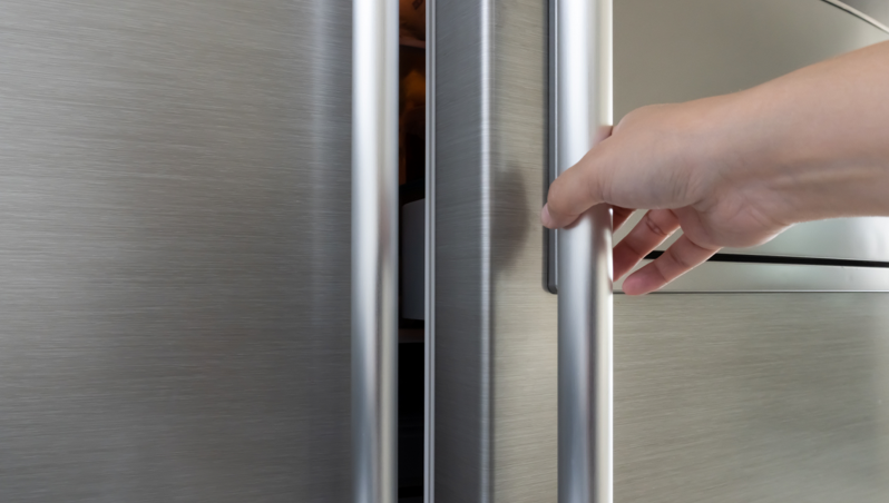 A person opening a fridge