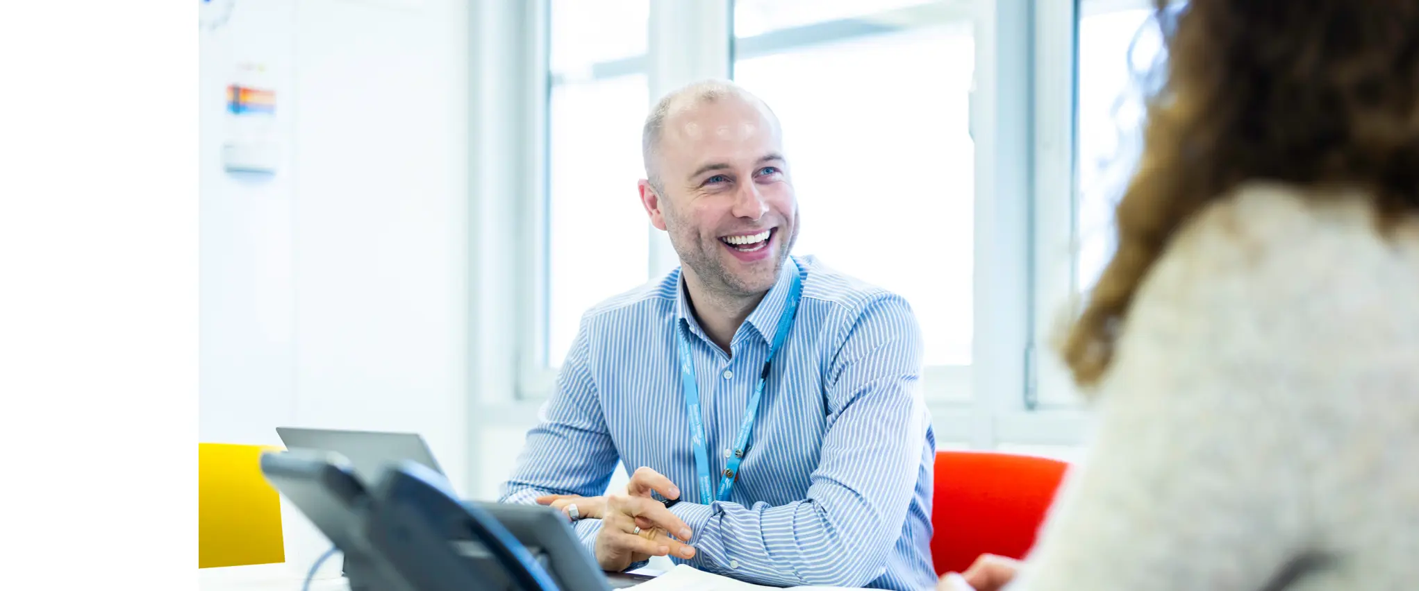 Office workers smiling while working